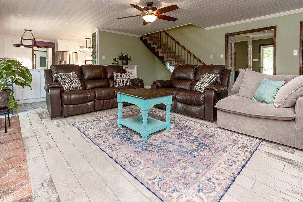 5870 Monk House Road Somerville, TN 38068 - Photo 8 of 40 a living room with furniture and a rug