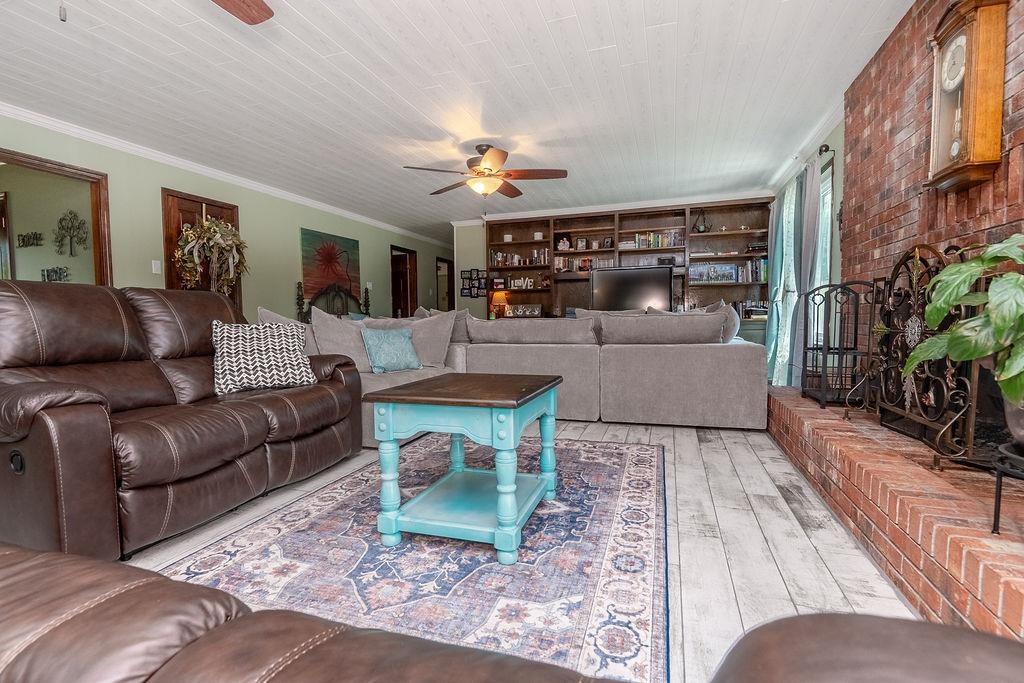 5870 Monk House Road Somerville, TN 38068 - Photo 9 of 40 a living room with furniture and a fireplace