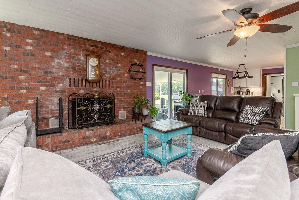 5870 Monk House Road Somerville, TN 38068 - Photo 10 of 40 a living room with furniture and a fireplace
