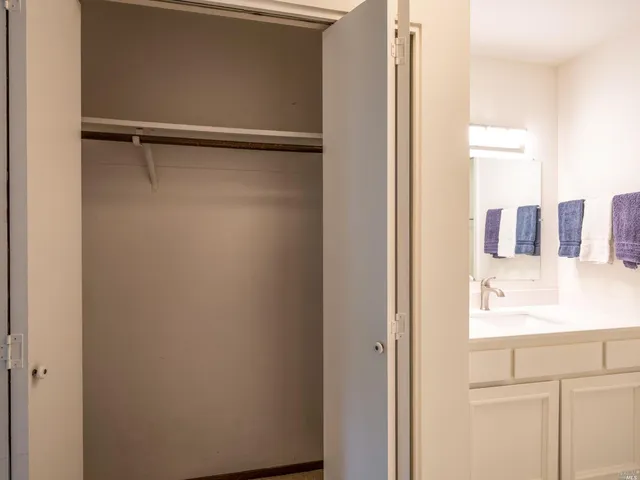 a bathroom with a shower and a sink