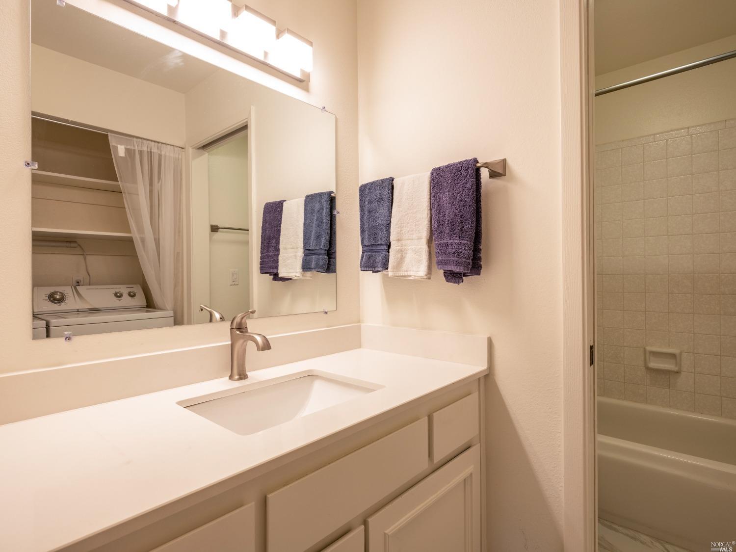 554 Seaver Drive Mill Valley, CA 94941 - Photo 16 of 33 a bathroom with a sink and a mirror