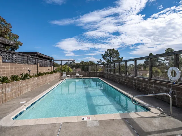 a view of a swimming pool with a patio