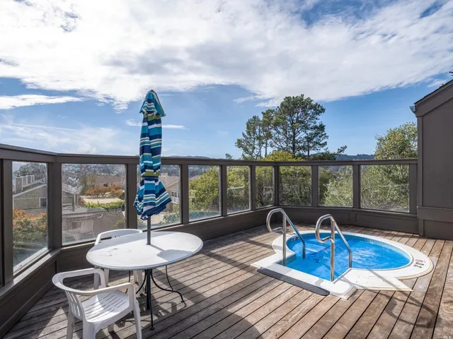 a view of a dining room with furniture wooden floor and chandelier