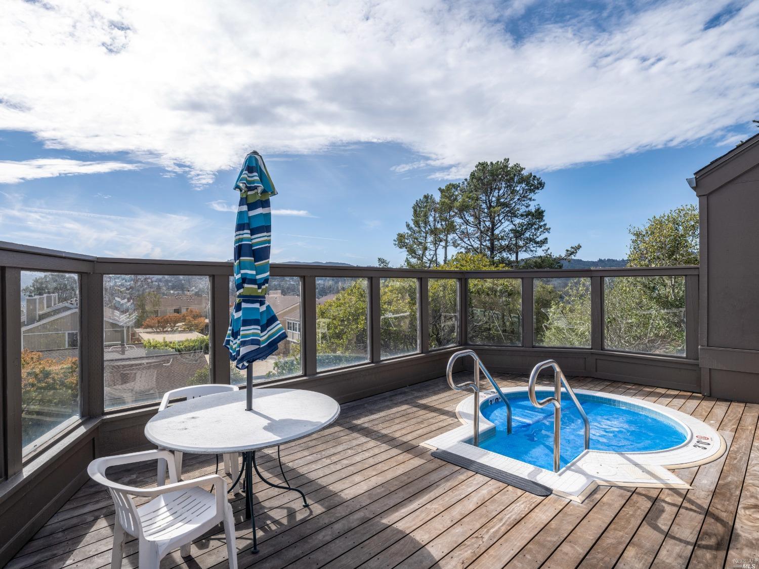 554 Seaver Drive Mill Valley, CA 94941 - Photo 22 of 33 a view of a dining room with furniture wooden floor and chandelier