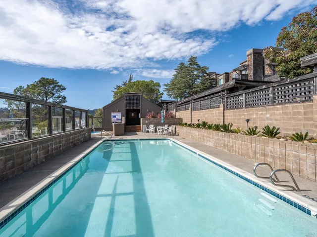 a view of balcony with a swimming pool