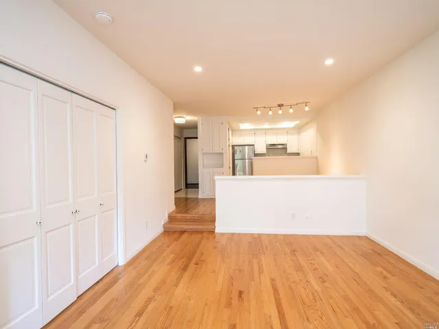 a view of a kitchen with wooden floor