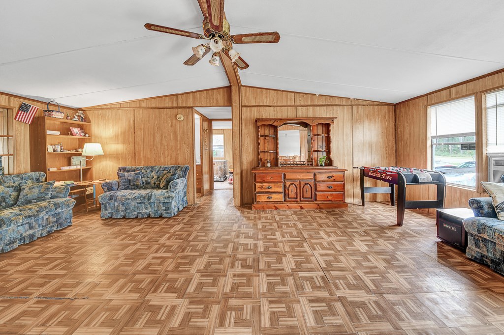 96697 Blackrock Road Yulee, FL 32097 - Photo 5 of 17 a living room with furniture and a flat screen tv