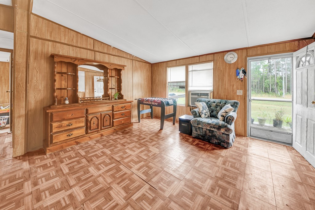 96697 Blackrock Road Yulee, FL 32097 - Photo 6 of 17 a living room with furniture and large windows