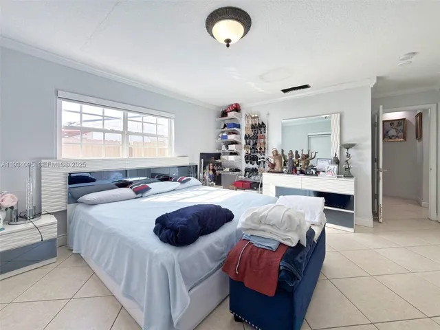 a living room with kitchen island furniture and a large window