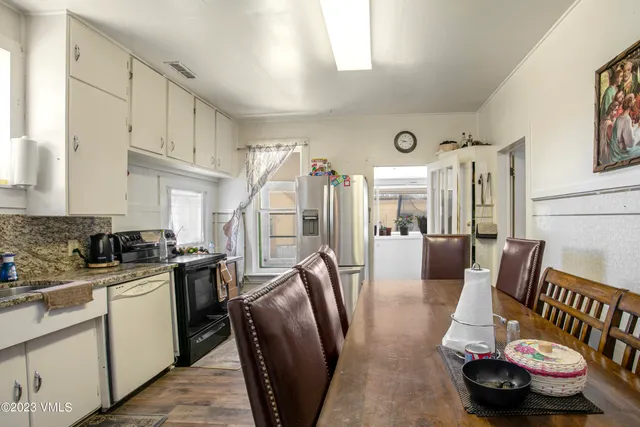a kitchen with stainless steel appliances granite countertop a sink and cabinets