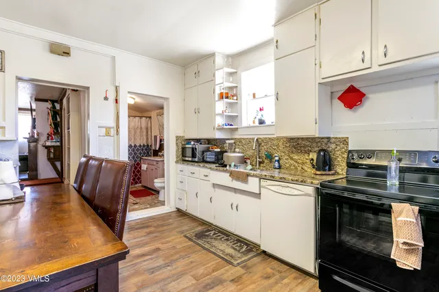 a kitchen with stainless steel appliances granite countertop a stove and a sink