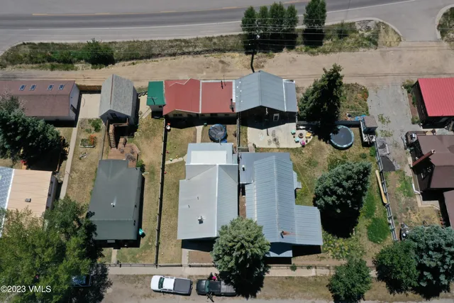 an aerial view of residential houses with outdoor space