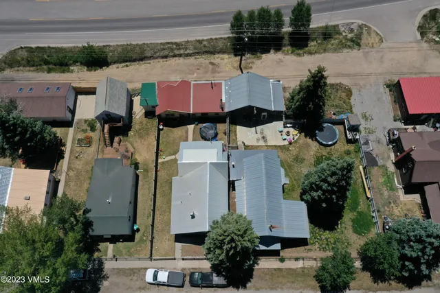 an aerial view of residential houses with outdoor space