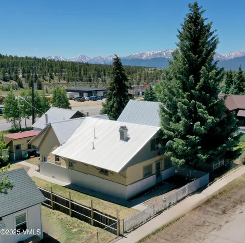 a view of a patio with table and chairs a barbeque and potted plants