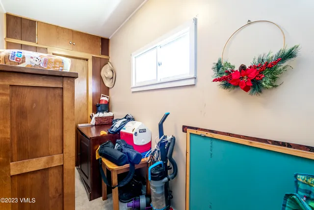 a bath room with sink and furniture