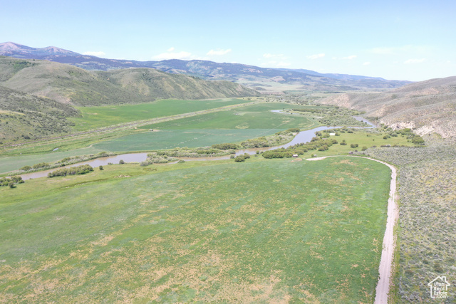 Undisclosed Address Georgetown, ID 83239 - Photo 3 of 11 View of mountain background featuring a nearby body of water