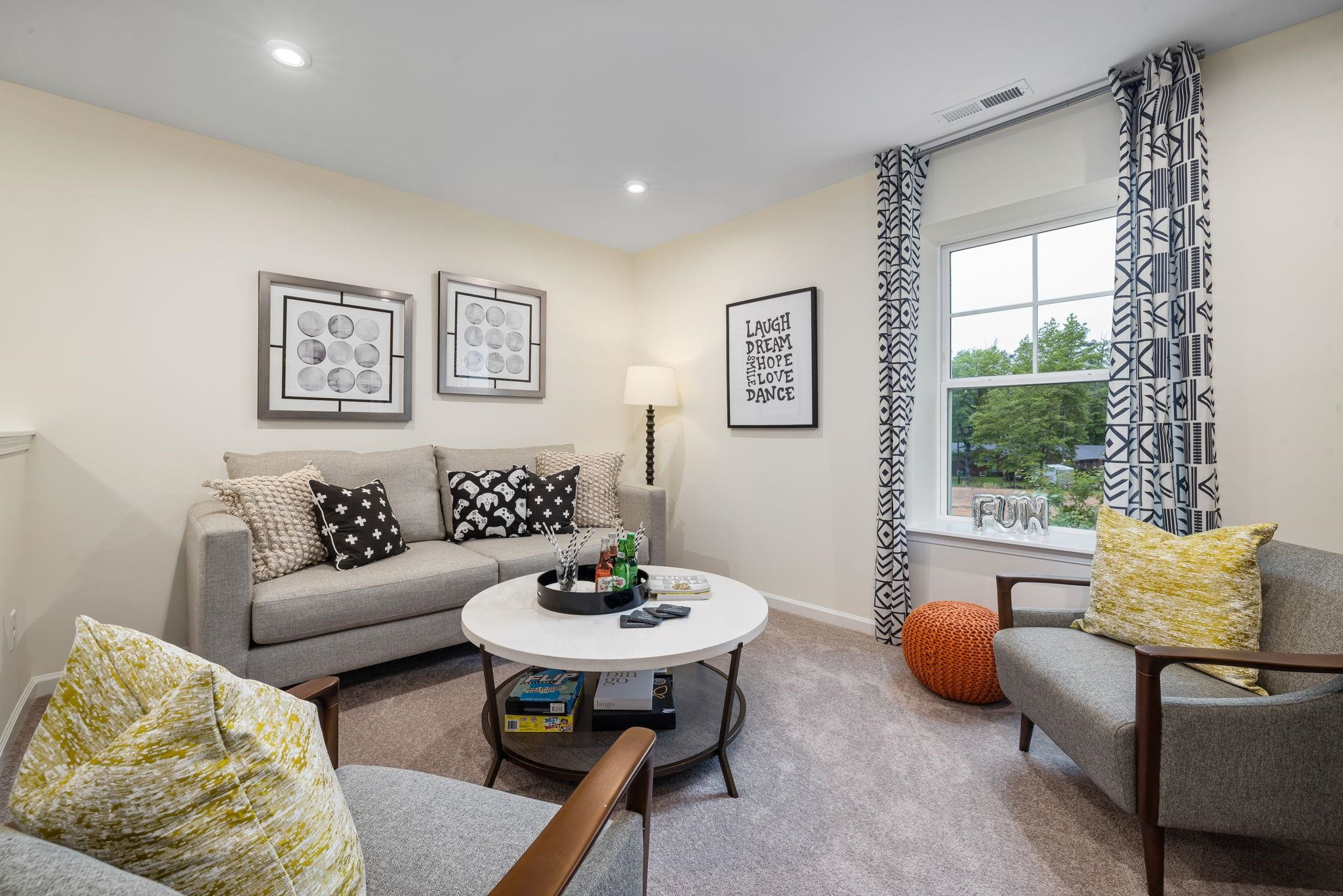 6512 Winter Spring Drive Wake Forest, NC 27587 - Photo 13 of 34 a living room with furniture and a window