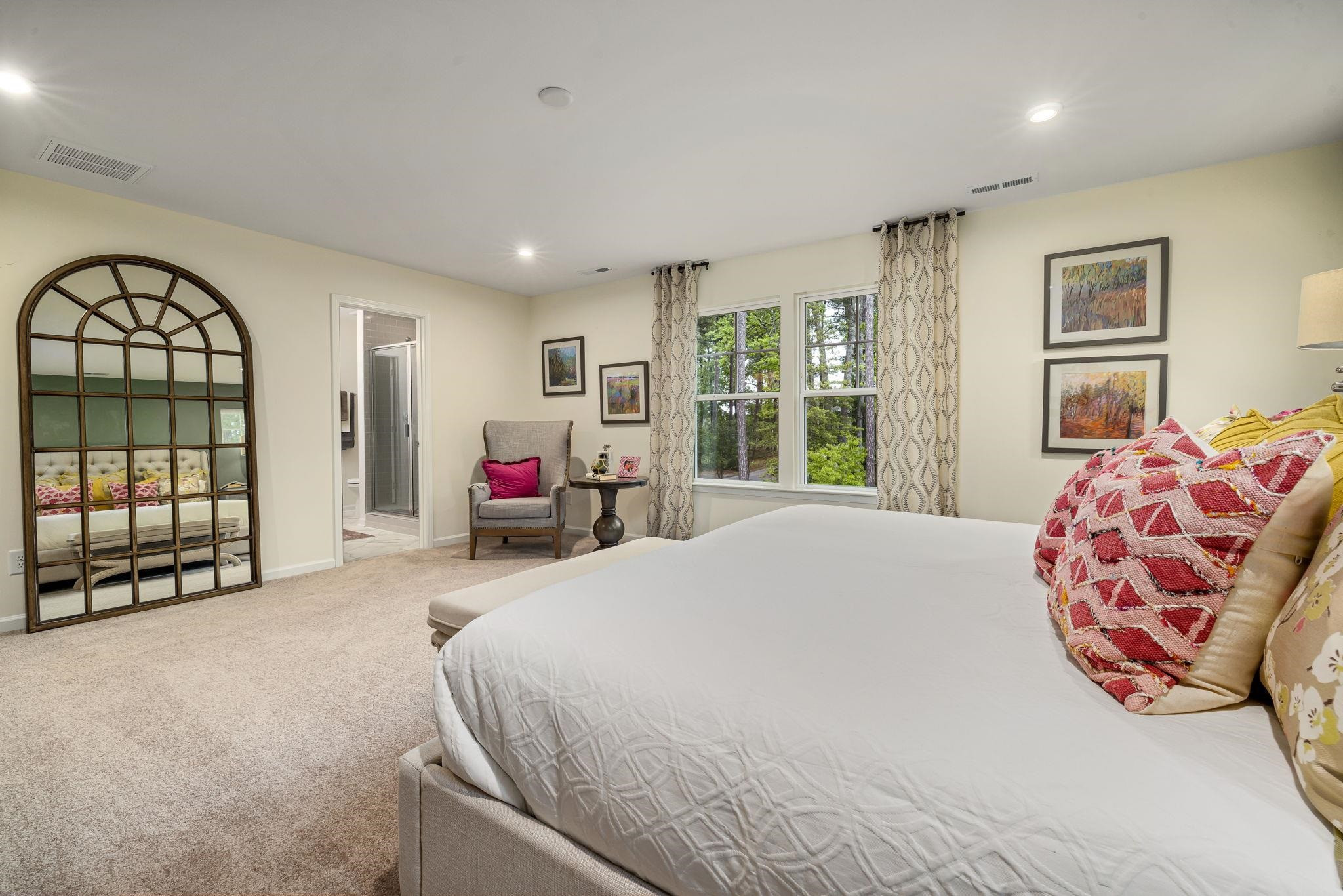 6512 Winter Spring Drive Wake Forest, NC 27587 - Photo 20 of 34 a bedroom with a bed and a large window