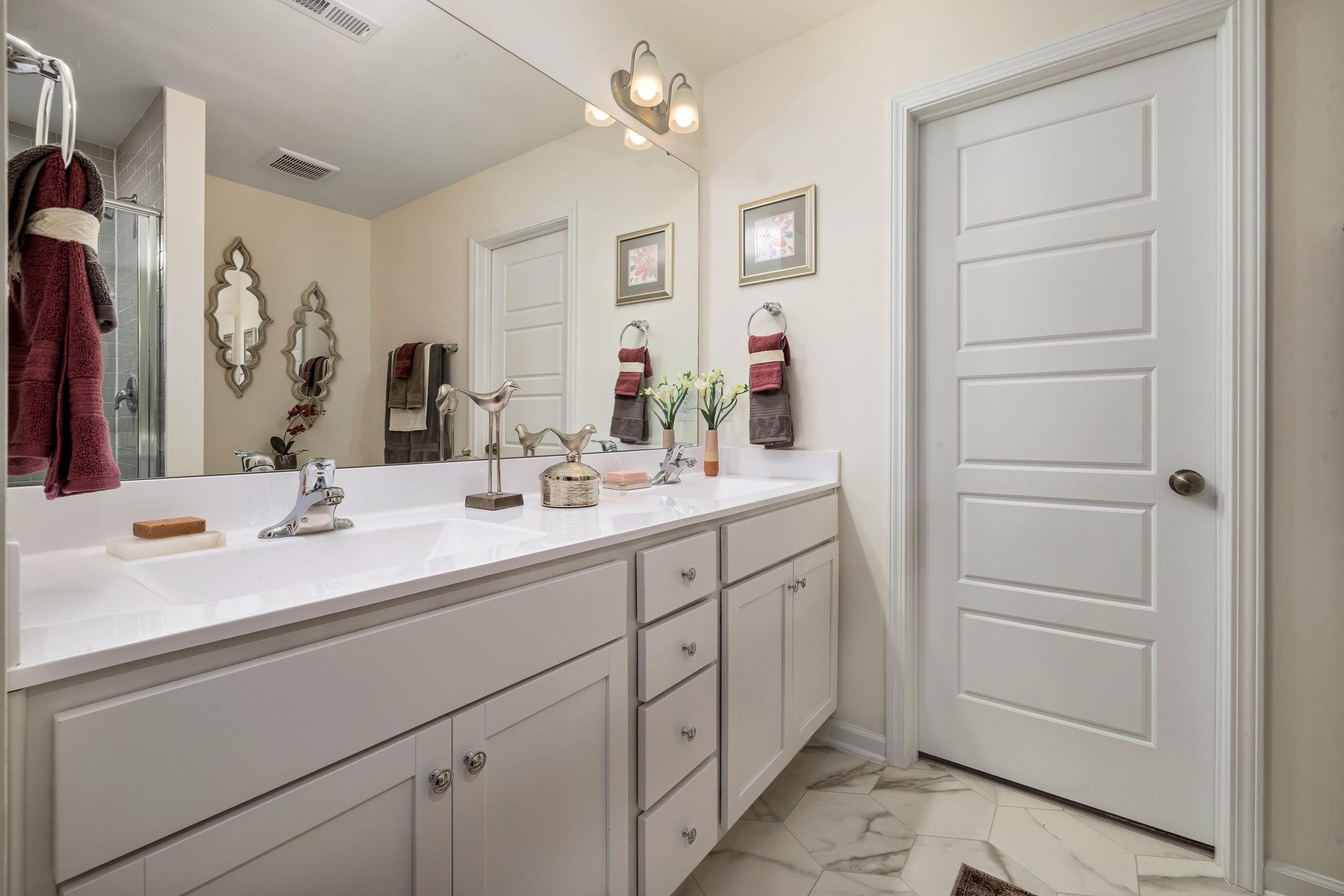 6512 Winter Spring Drive Wake Forest, NC 27587 - Photo 22 of 34 a bathroom with a sink vanity and a mirror