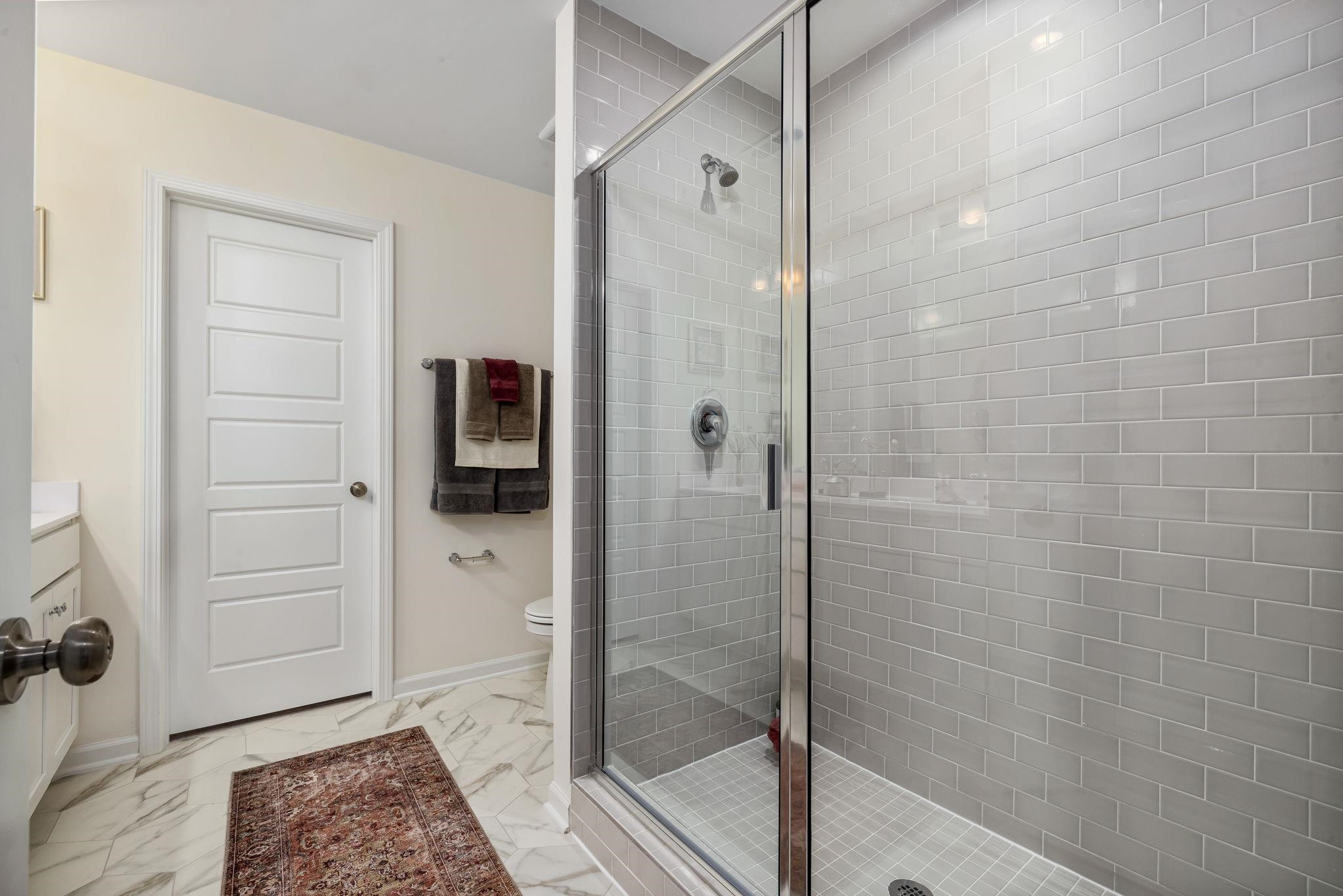 6512 Winter Spring Drive Wake Forest, NC 27587 - Photo 23 of 34 a bathroom with a shower and a sink
