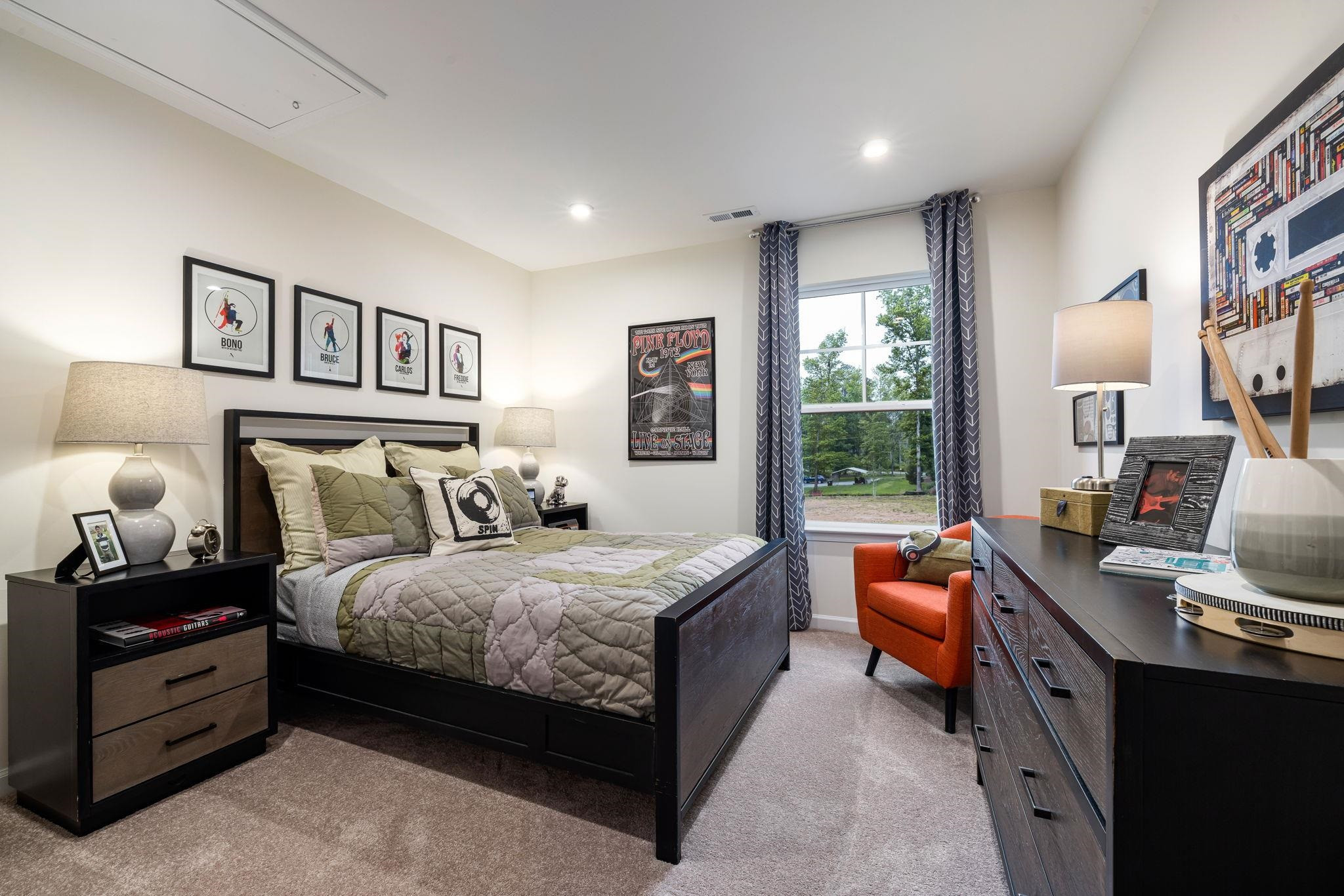 6512 Winter Spring Drive Wake Forest, NC 27587 - Photo 29 of 34 a bedroom with a bed couch and a window