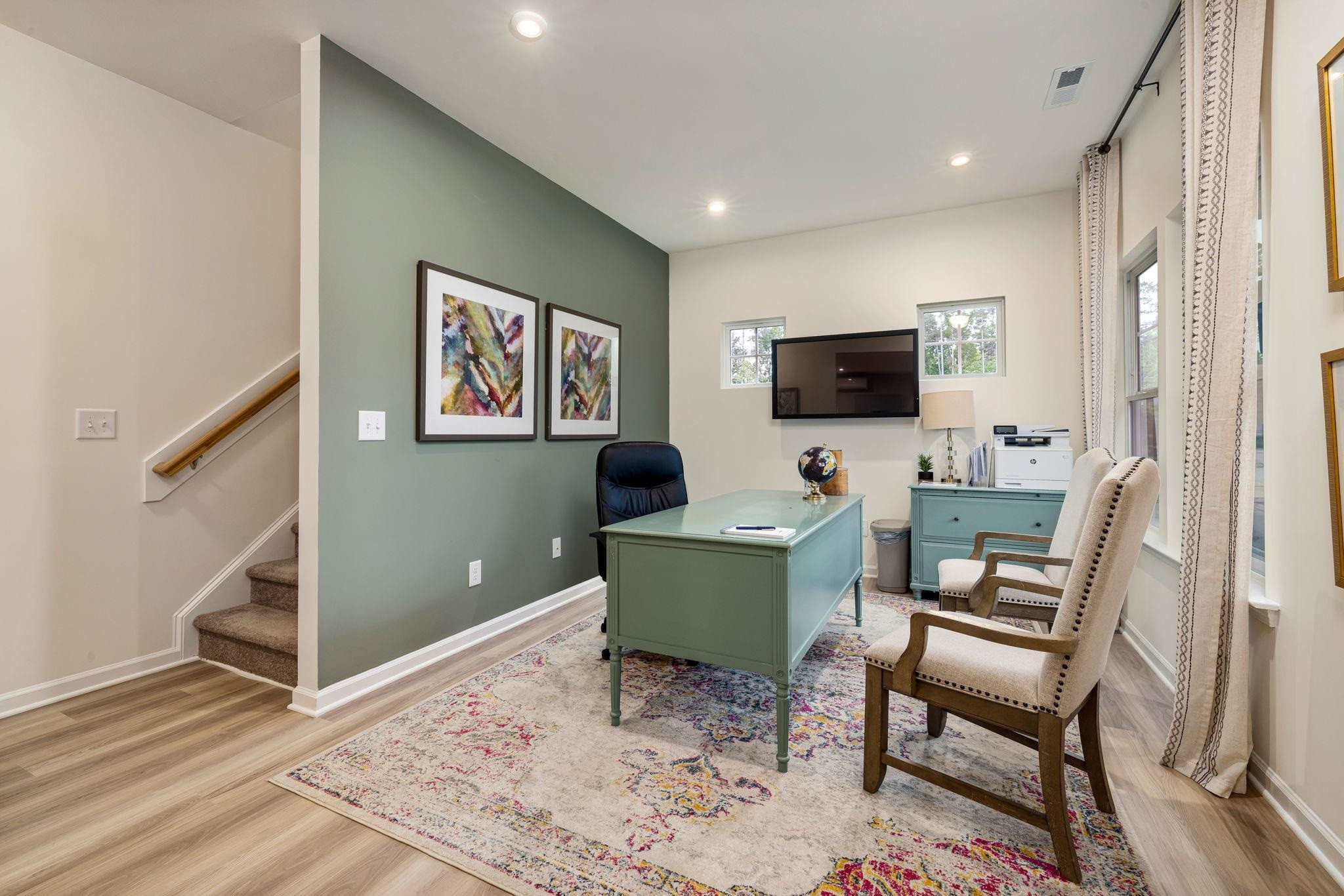 6512 Winter Spring Drive Wake Forest, NC 27587 - Photo 3 of 34 a work room with furniture and a flat screen tv
