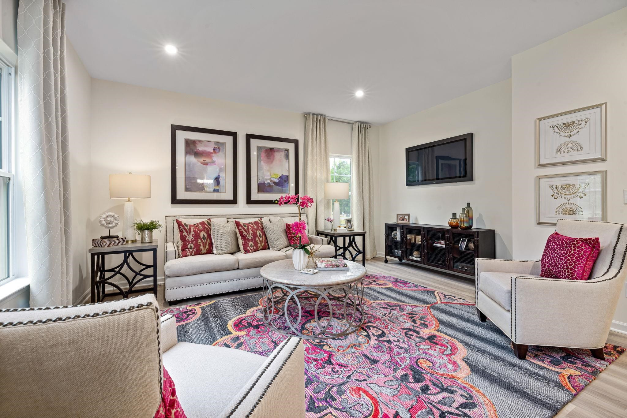 6512 Winter Spring Drive Wake Forest, NC 27587 - Photo 5 of 34 a living room with furniture and a flat screen tv