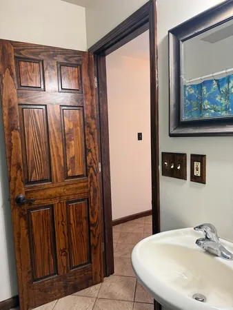 a bathroom with a sink and a mirror