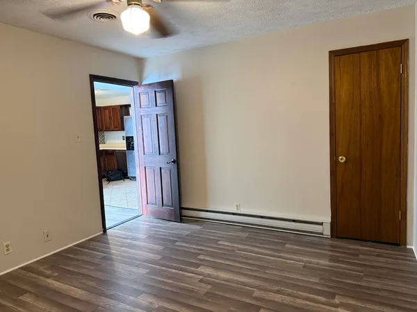 a view of a livingroom with wooden floor