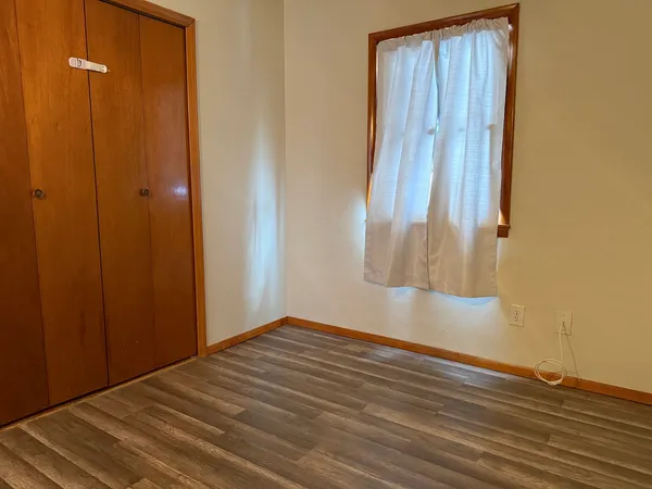 a view of a small space with wooden floor