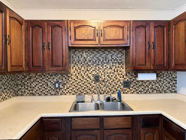 a bathroom with a sink a vanity and a bathtub