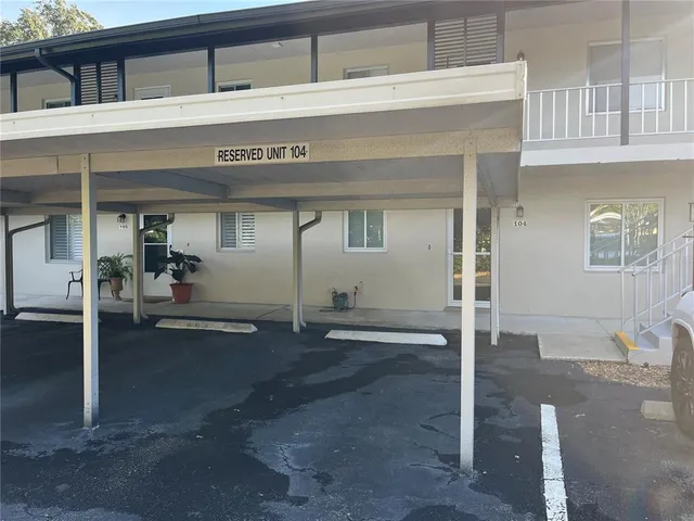 a view of a front door and bedroom