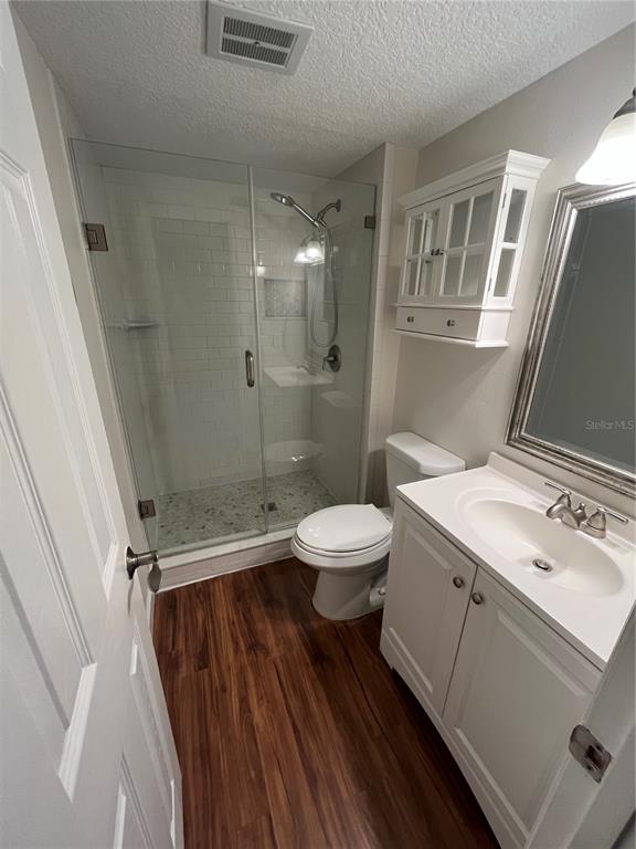 210 Magnolia Road, Unit 104 Maitland, FL 32751 - Photo 12 of 16 a bathroom with a sink a toilet a mirror and shower