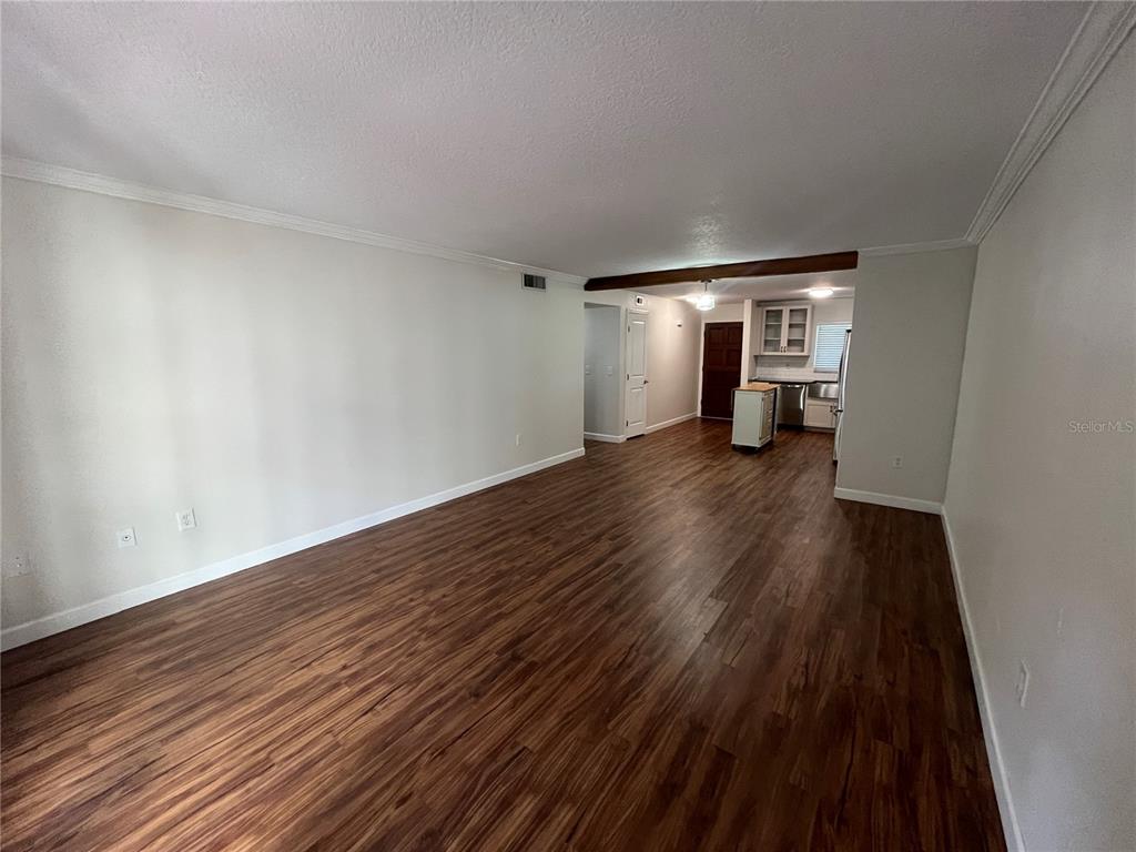 210 Magnolia Road, Unit 104 Maitland, FL 32751 - Photo 7 of 16 a view of empty room with wooden floor