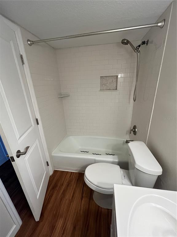 210 Magnolia Road, Unit 104 Maitland, FL 32751 - Photo 10 of 16 a white toilet sitting next to a bath tub