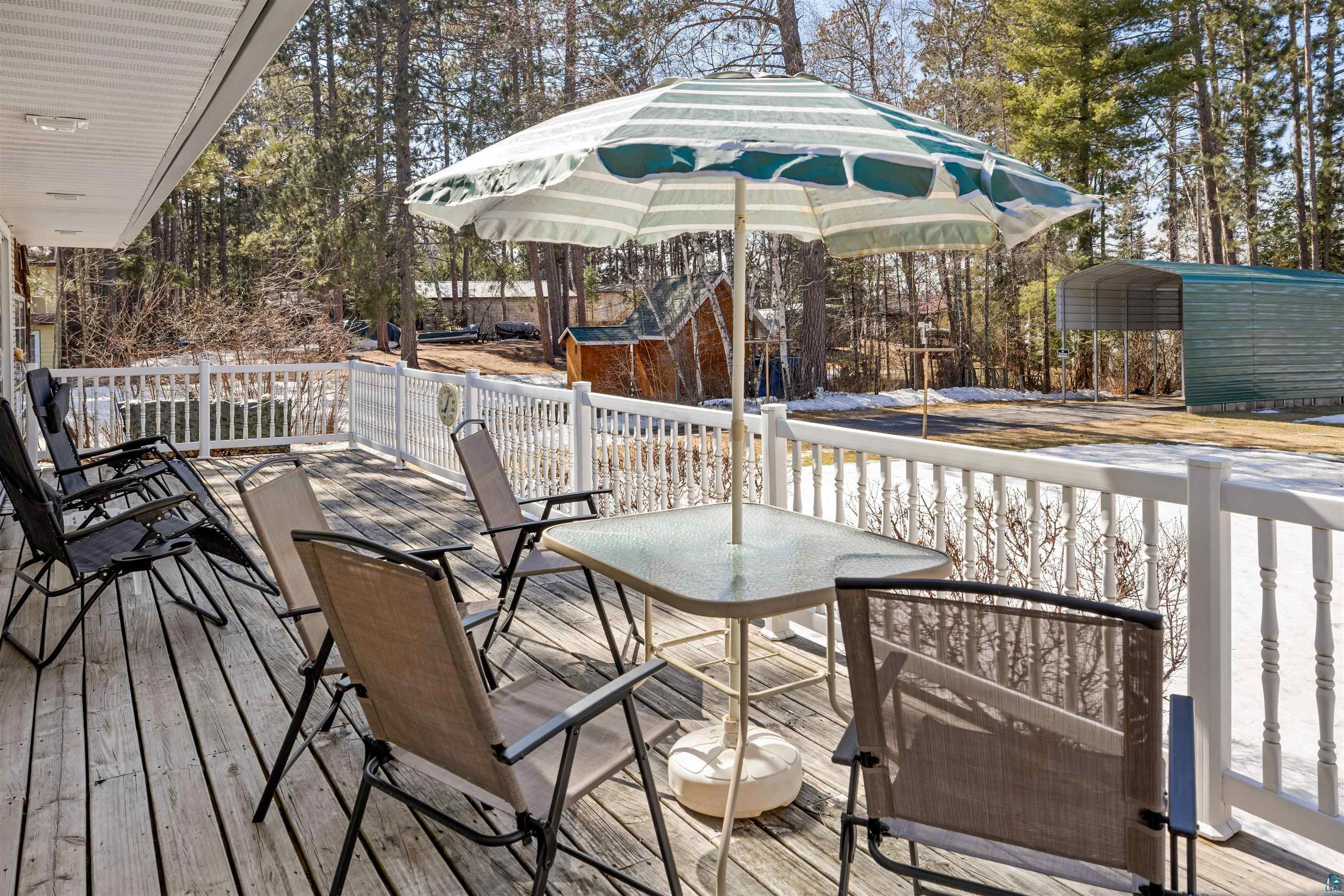 3975 Long Lake Shores Road Eveleth, MN 55734 - Photo 59 of 84 Deck featuring a carport and outdoor dining area
