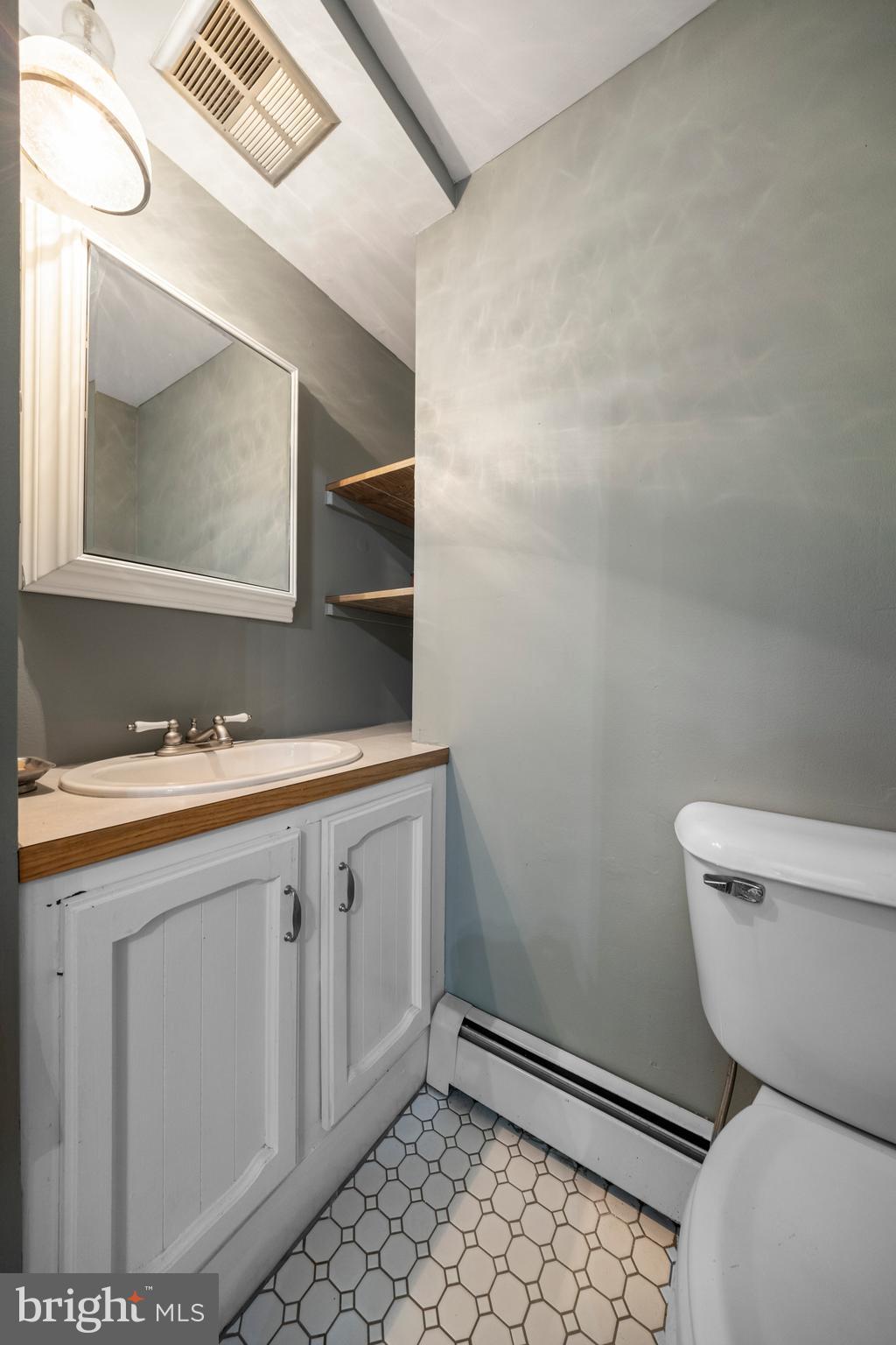 136 Lambs Road Sewell, NJ 08080 - Photo 18 of 65 a bathroom with a sink toilet and mirror
