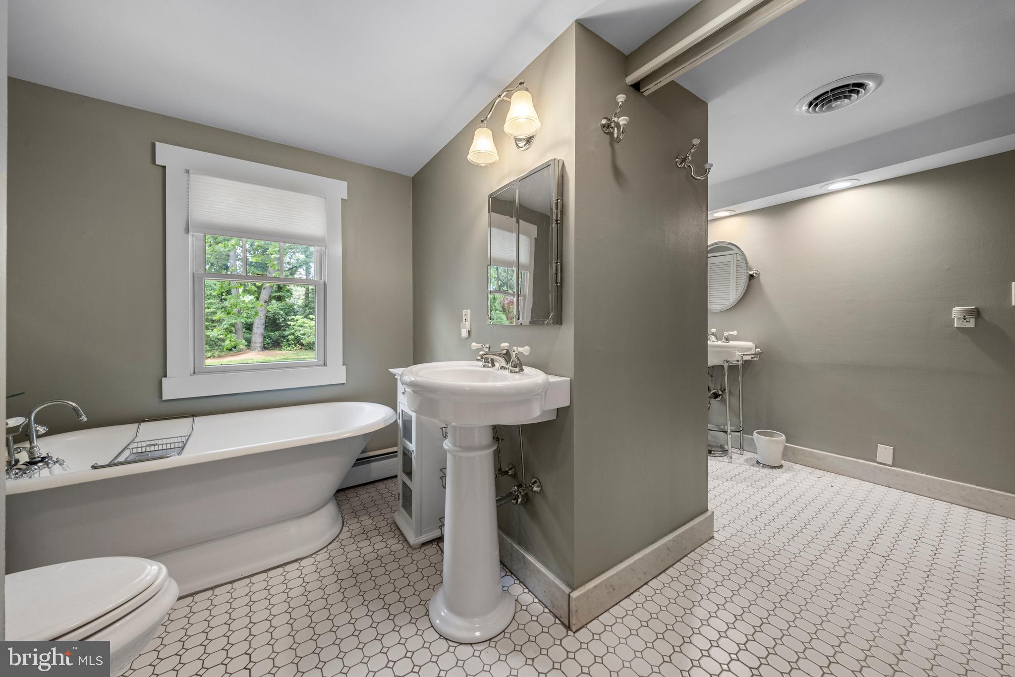 136 Lambs Road Sewell, NJ 08080 - Photo 25 of 65 a bathroom with a sink a toilet and shower