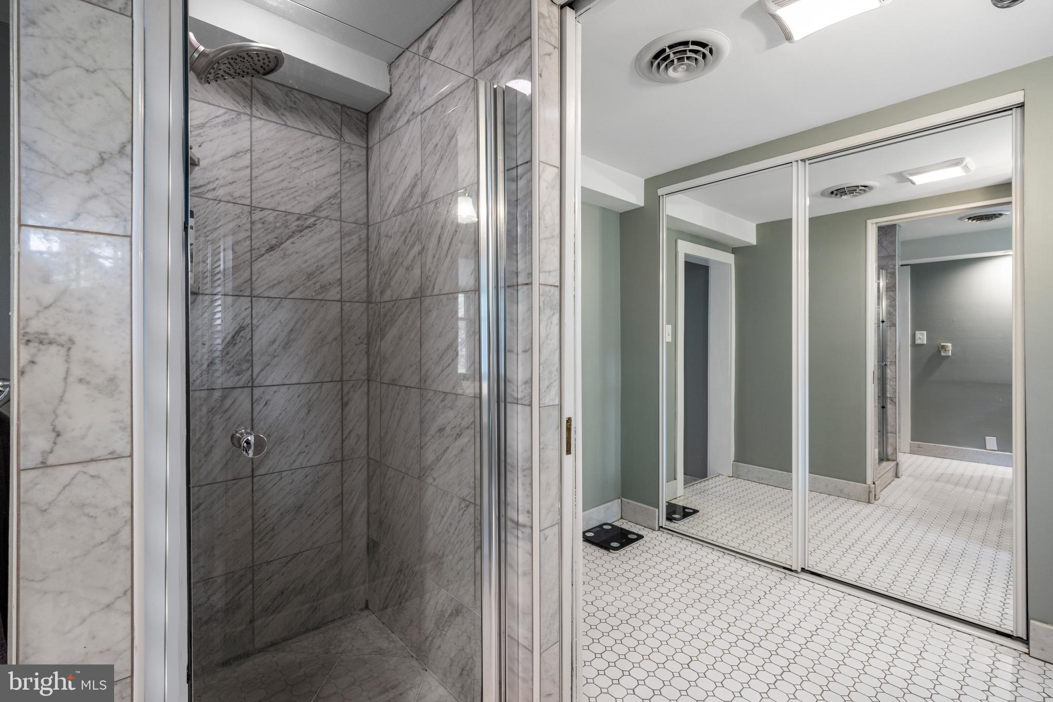 136 Lambs Road Sewell, NJ 08080 - Photo 26 of 65 a bathroom with a glass shower door and a glass door shower