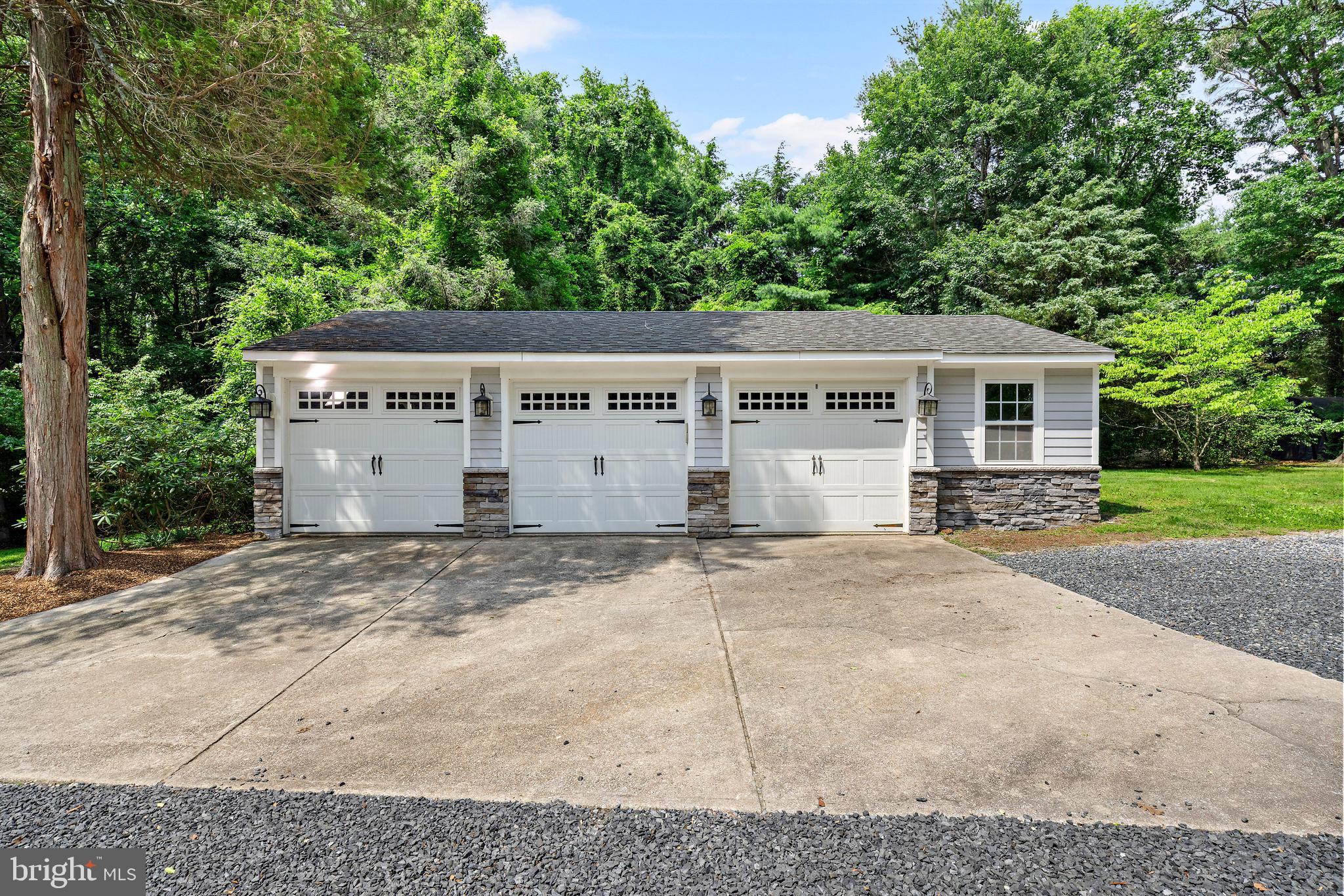 136 Lambs Road Sewell, NJ 08080 - Photo 31 of 65 a view of a house with a yard and garage