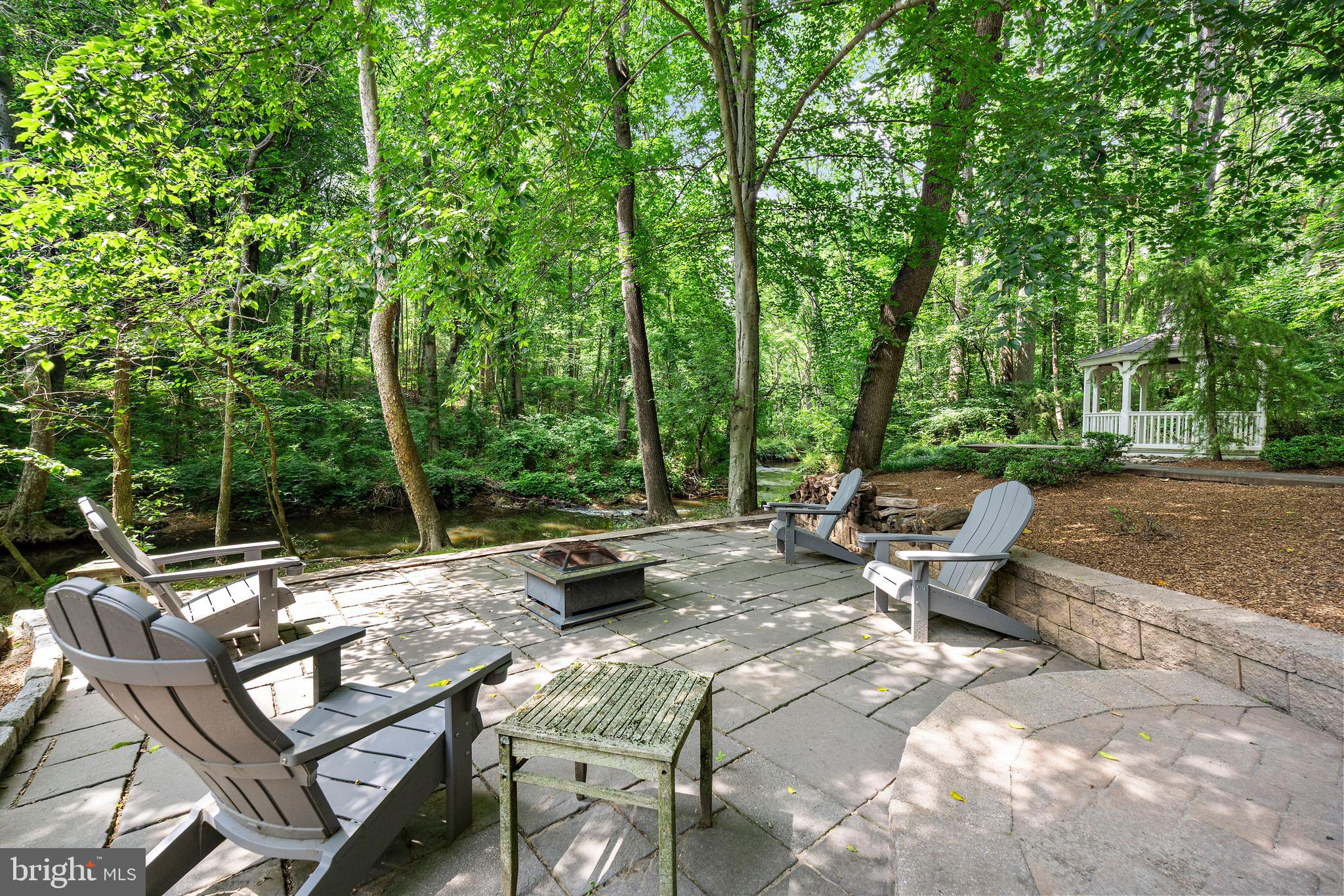 136 Lambs Road Sewell, NJ 08080 - Photo 37 of 65 a view of a bench with chairs in a backyard