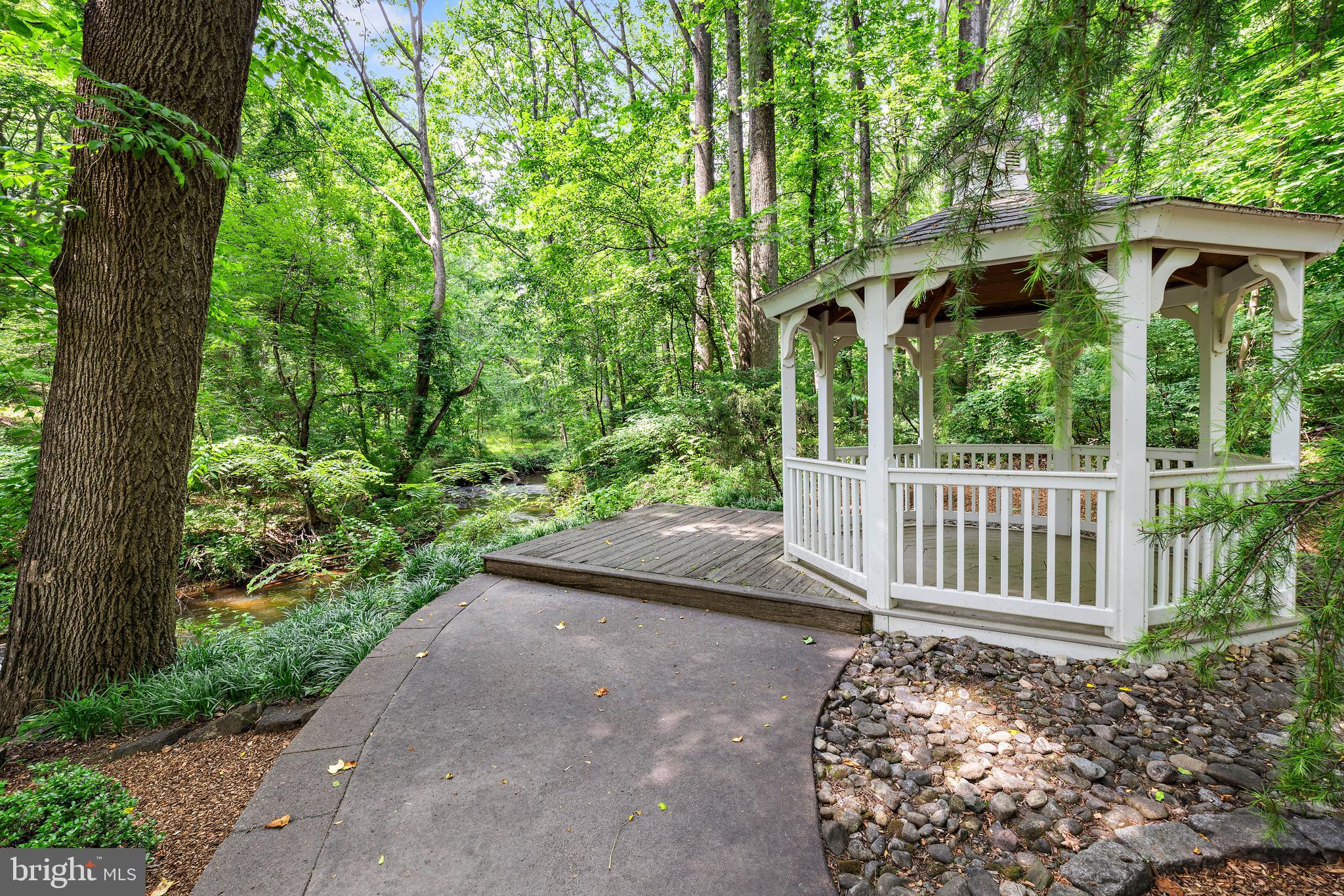 136 Lambs Road Sewell, NJ 08080 - Photo 39 of 65 a view of a yard with plants and deck