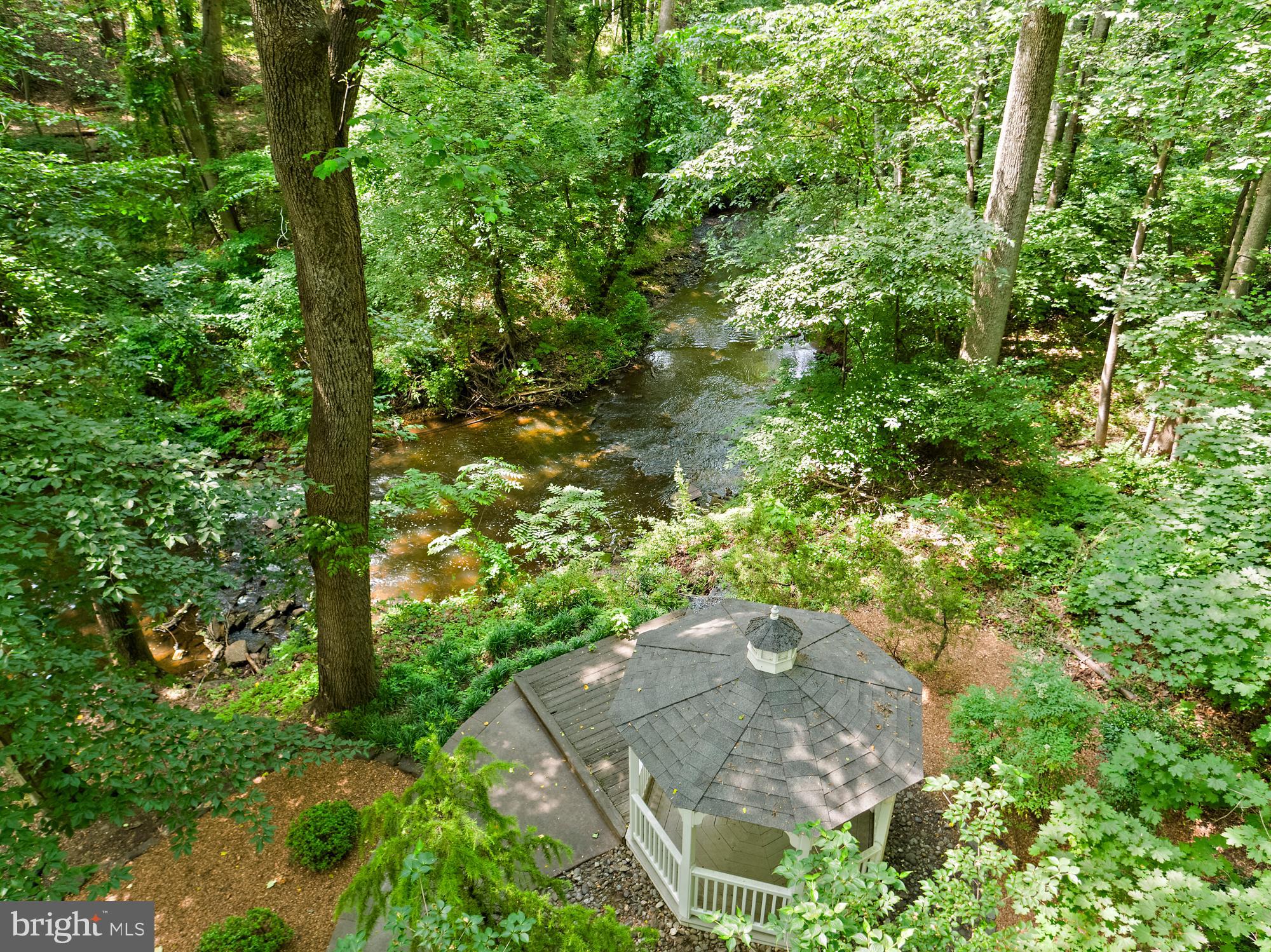 136 Lambs Road Sewell, NJ 08080 - Photo 40 of 65 a backyard of a house with a yard and fountain