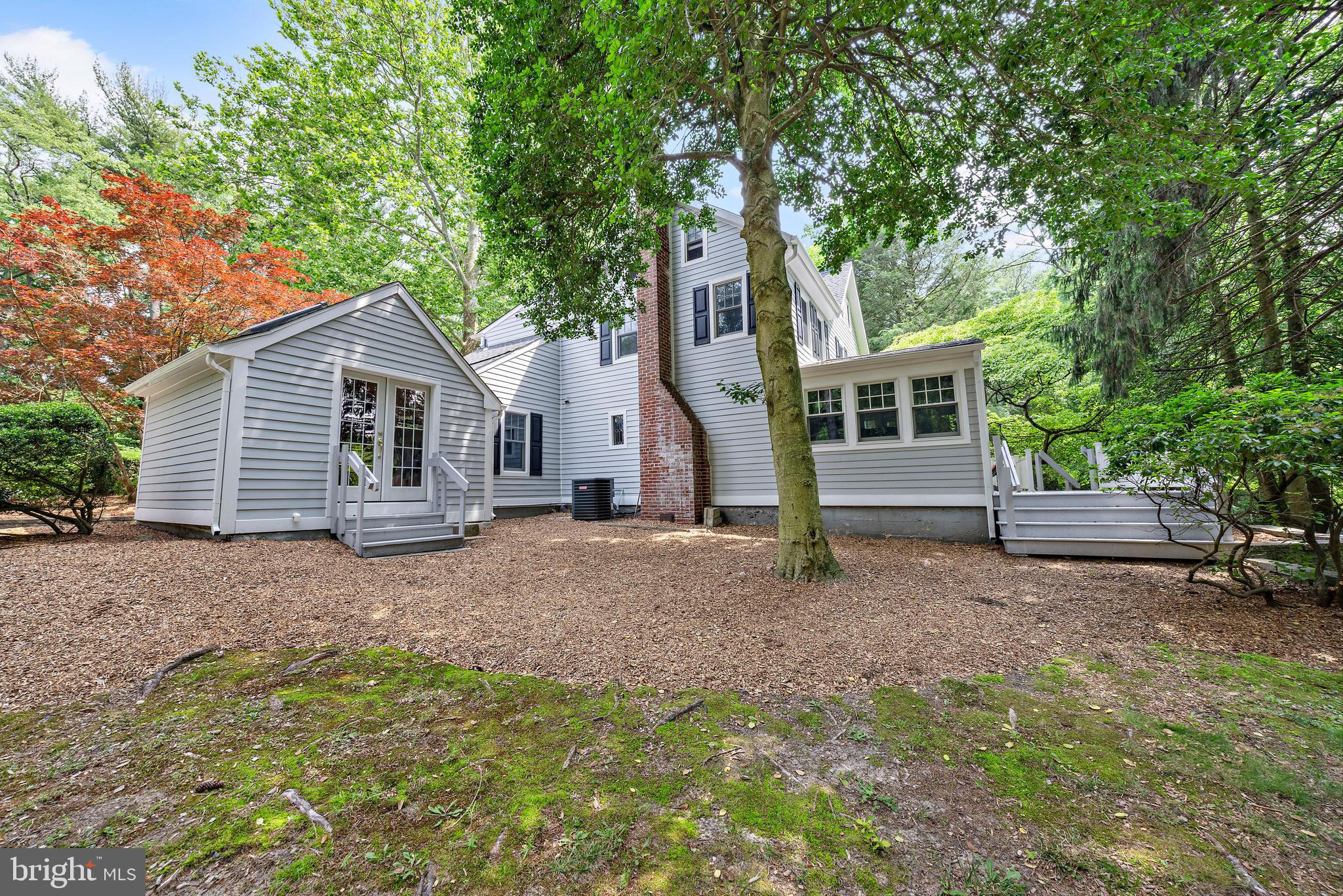 136 Lambs Road Sewell, NJ 08080 - Photo 44 of 65 a view of a house with a yard tree and wooden fence