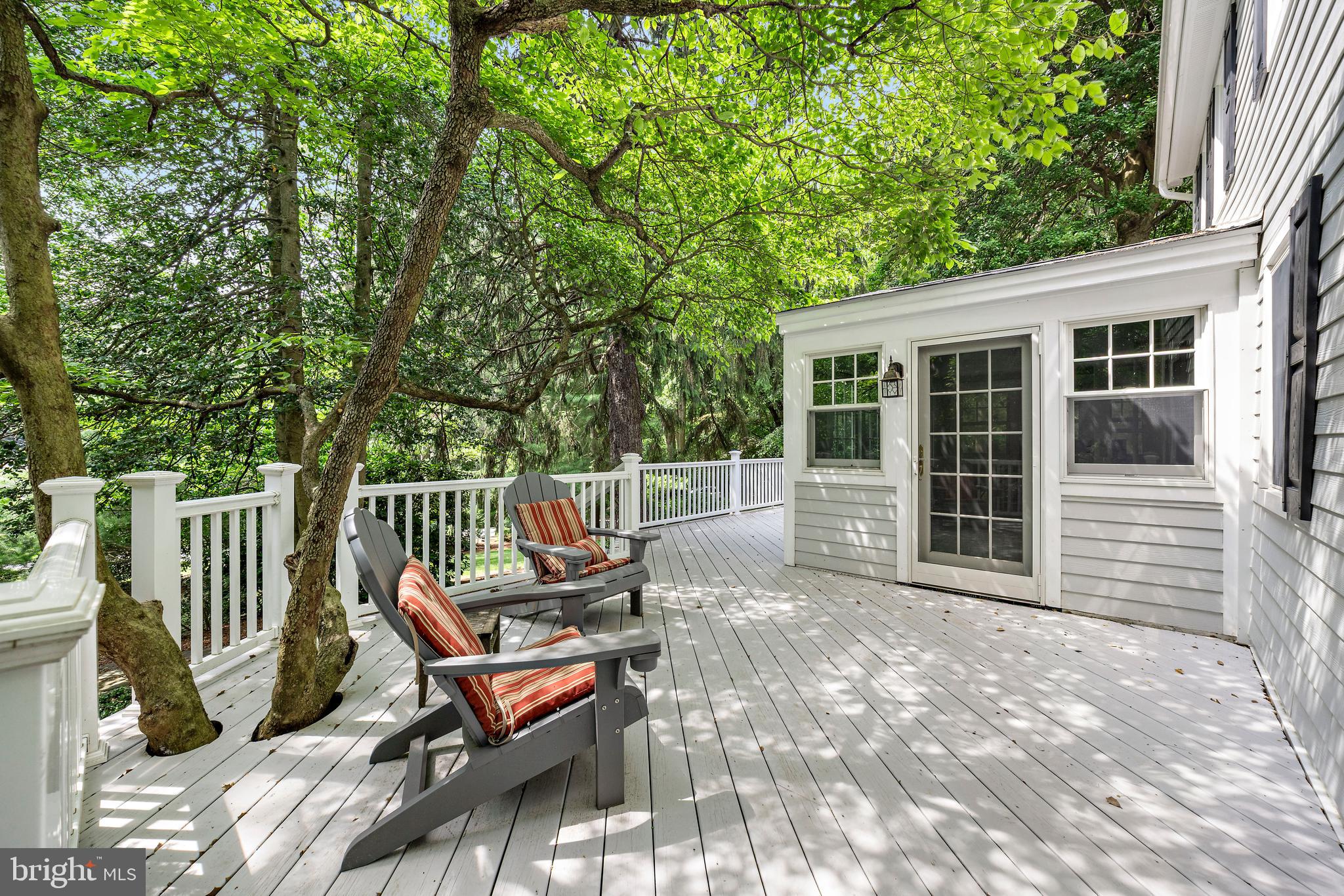 136 Lambs Road Sewell, NJ 08080 - Photo 51 of 65 a view of a chairs and table in the back yard of the house