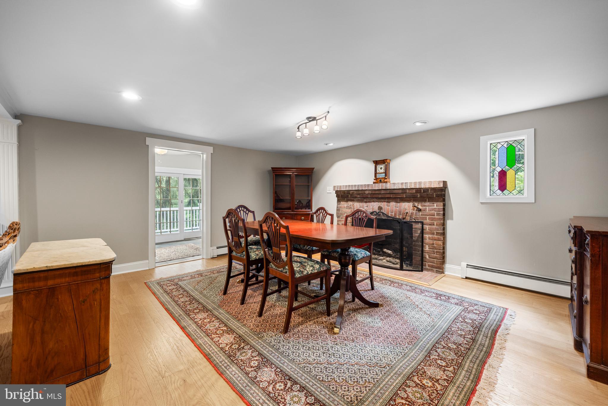 136 Lambs Road Sewell, NJ 08080 - Photo 6 of 65 a living room with furniture a rug and a dining table
