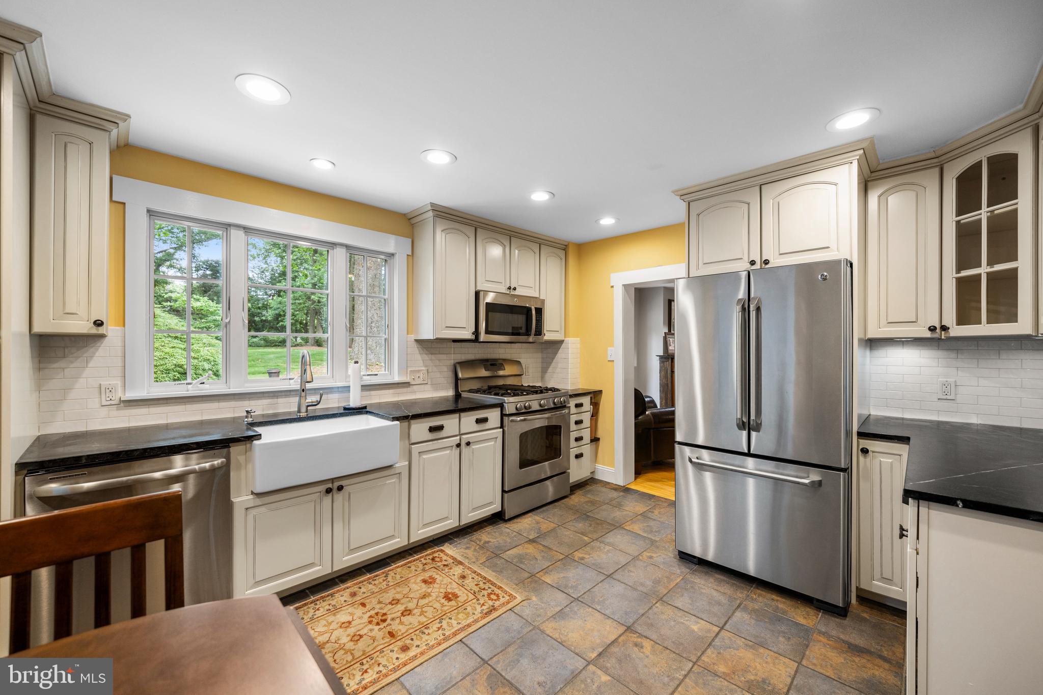 136 Lambs Road Sewell, NJ 08080 - Photo 9 of 65 a kitchen with granite countertop stainless steel appliances a refrigerator cabinets and wooden floor