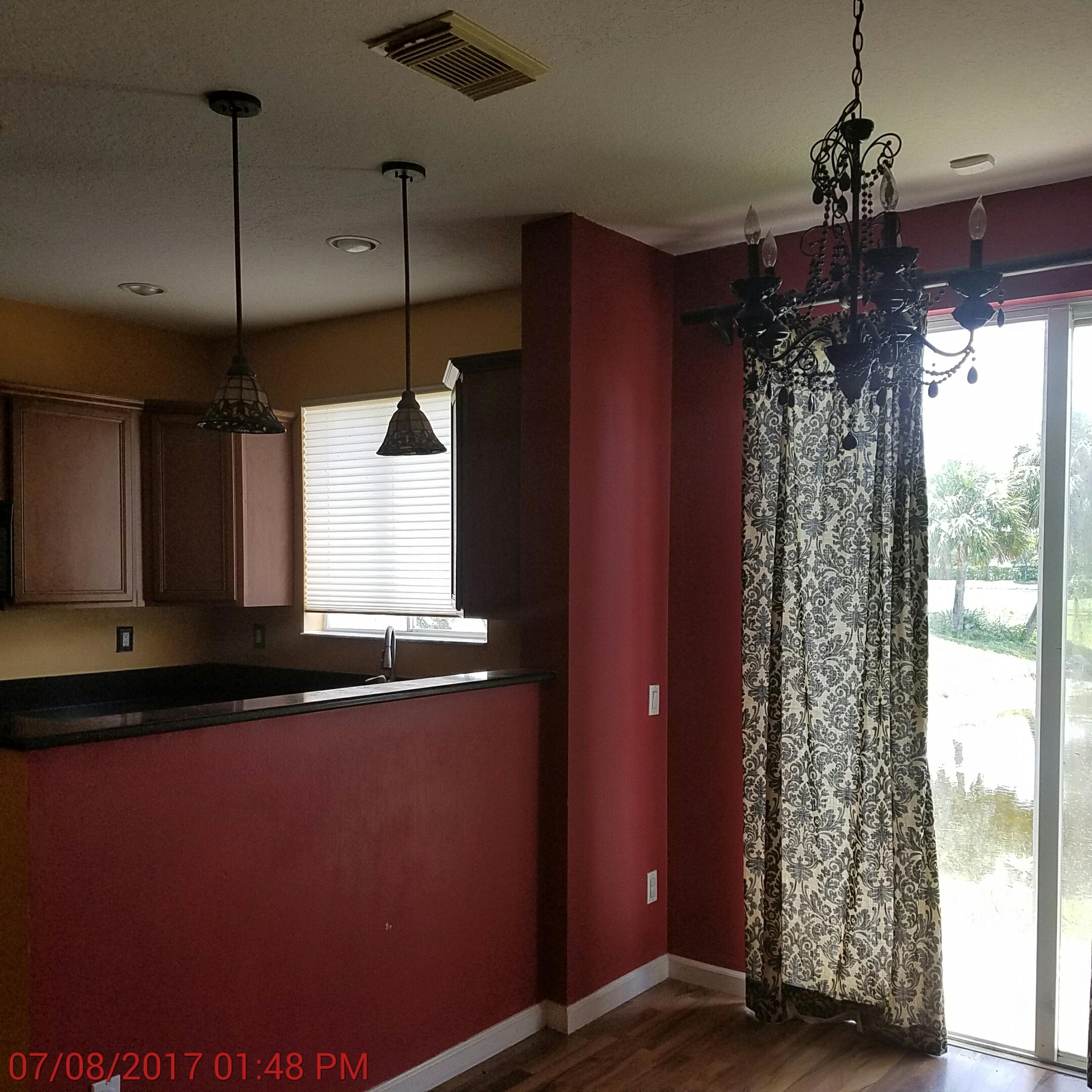 3117 Laurel Ridge Circle Riviera Beach, FL 33404 - Photo 7 of 27 a view of a room with window and wooden floor