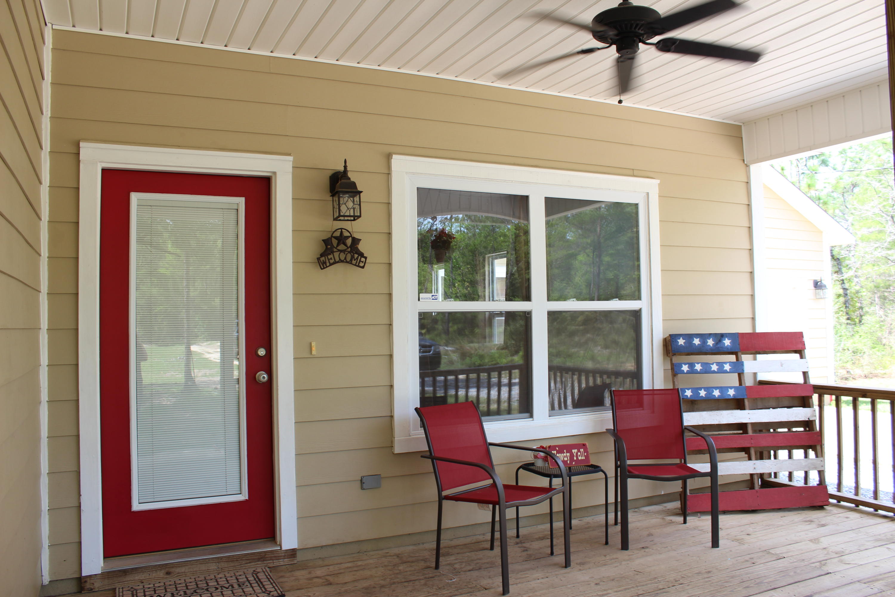 1563 Hinote Road DeFuniak Springs, FL 32433 - Photo 2 of 36 a balcony with furniture and a window