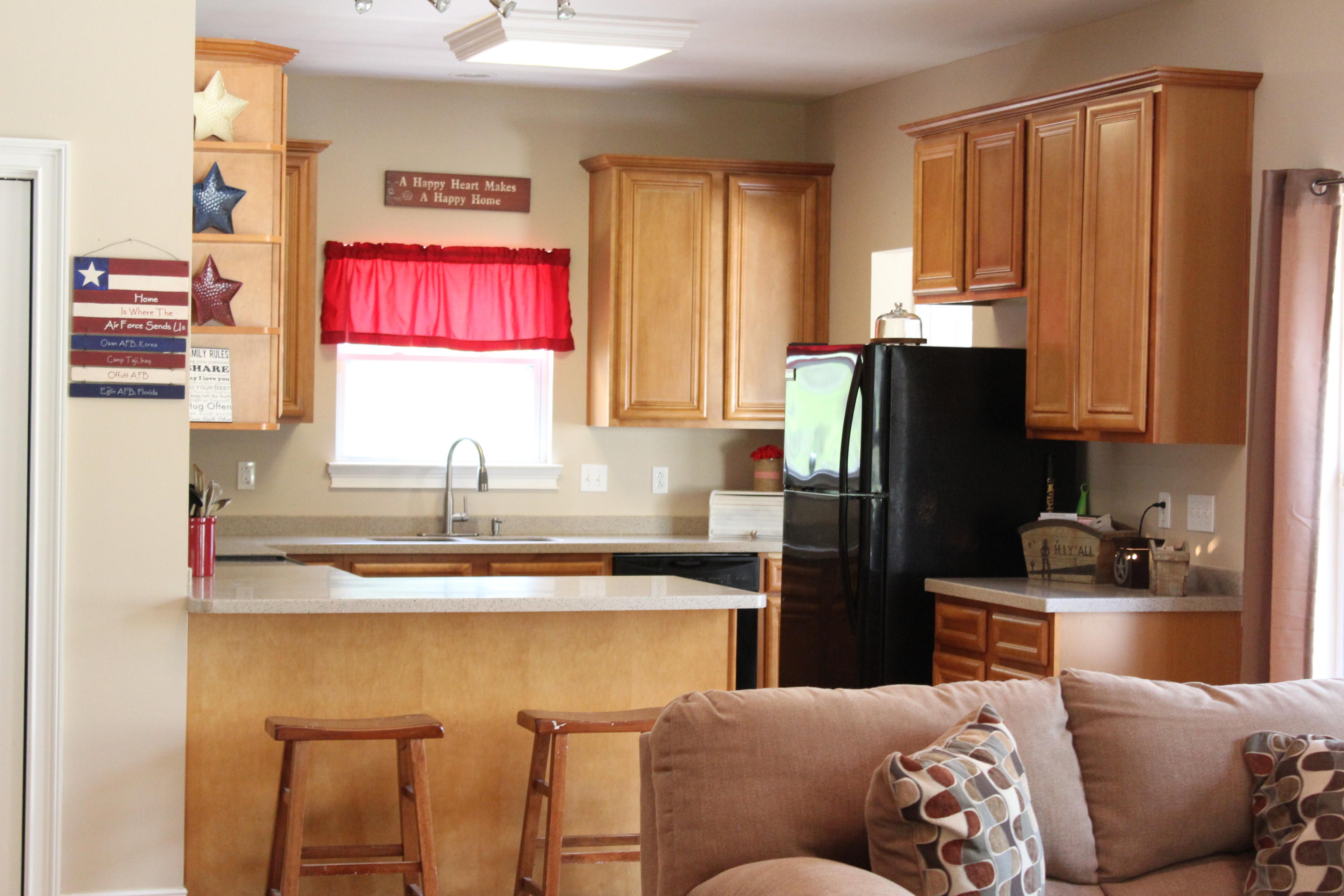 1563 Hinote Road DeFuniak Springs, FL 32433 - Photo 12 of 36 a kitchen with stainless steel appliances granite countertop a refrigerator and a sink